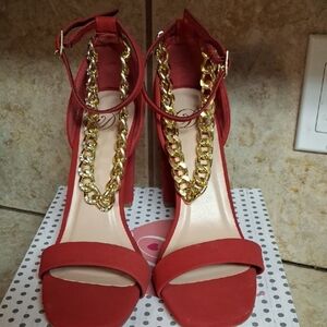 RedHeels With Gold Chains Around The Ankle